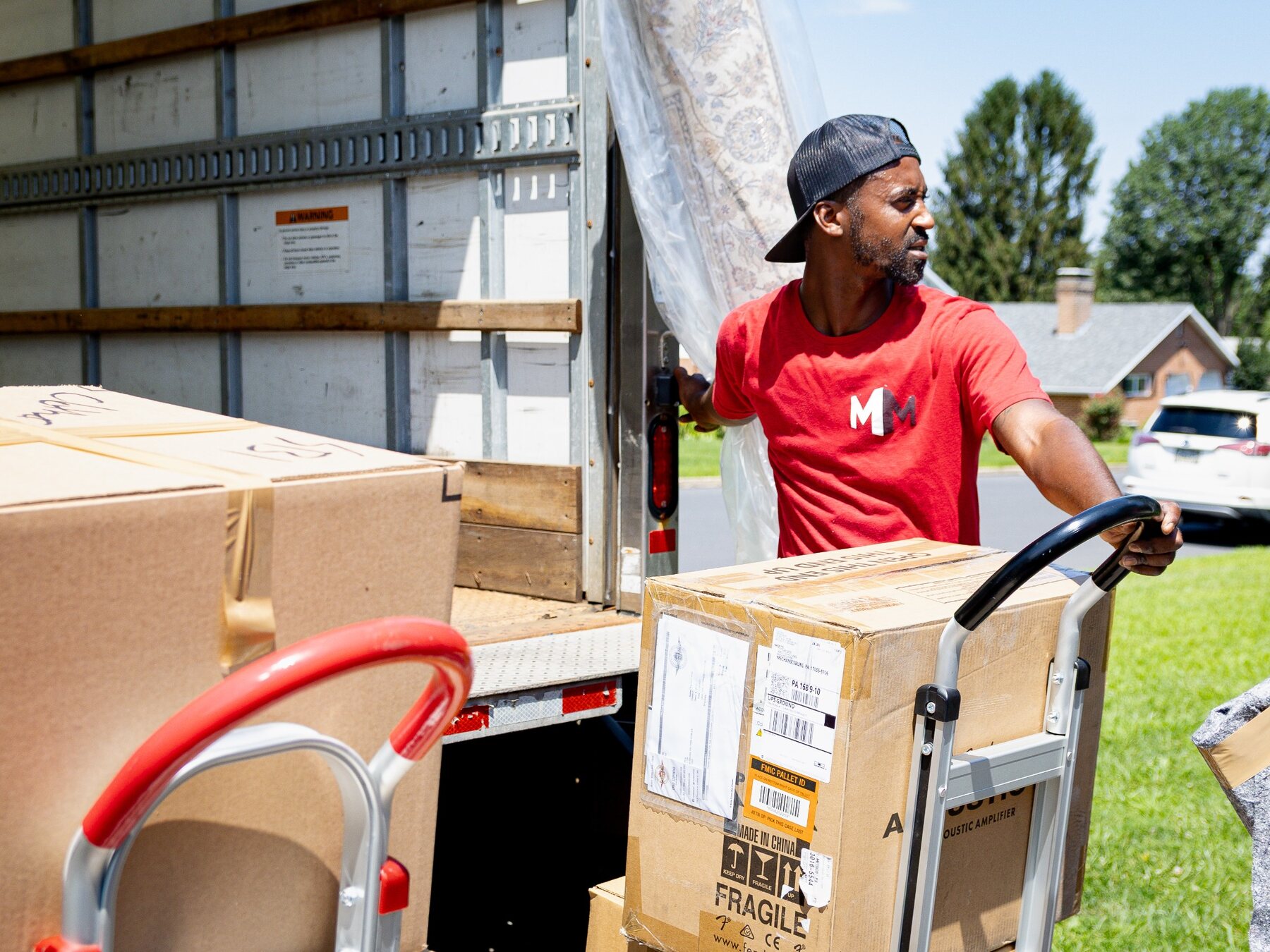 Making Moves team member unloading a moving truck